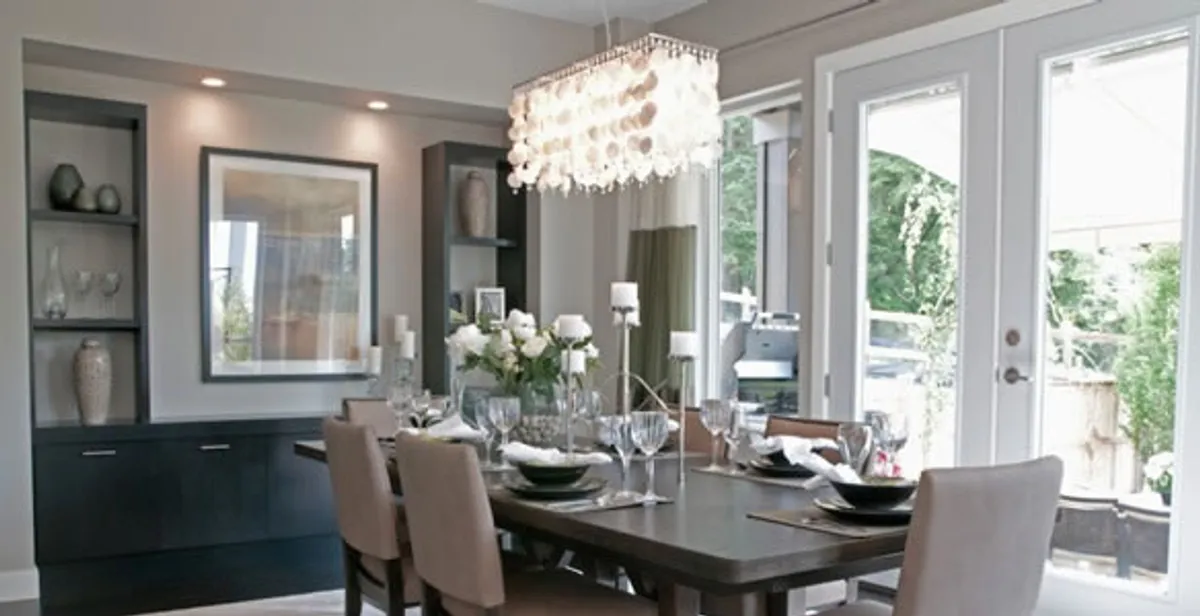 Elegant dining room chandelier installation above table in Allentown, PA