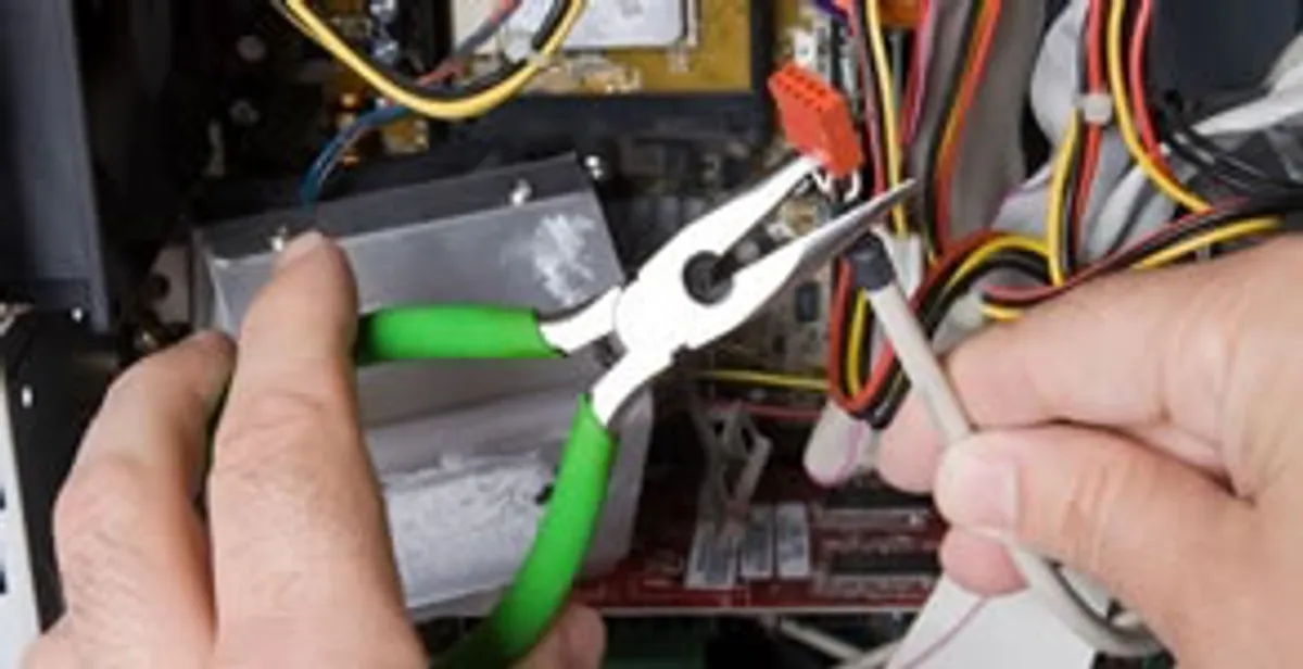 Licensed electrical contractor performing electrical repair with tools in Center Valley, PA
